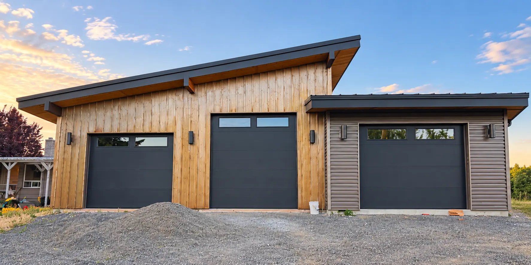Three charcoal garage doors installed on a contemporary Central Washington shop